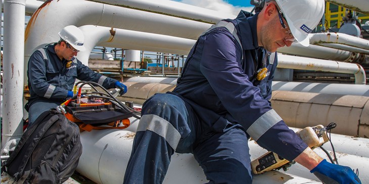 IRISNDT workers perform both guided wave testing (GWT) and ultrasonic thickness testing (UTT) on some piping.