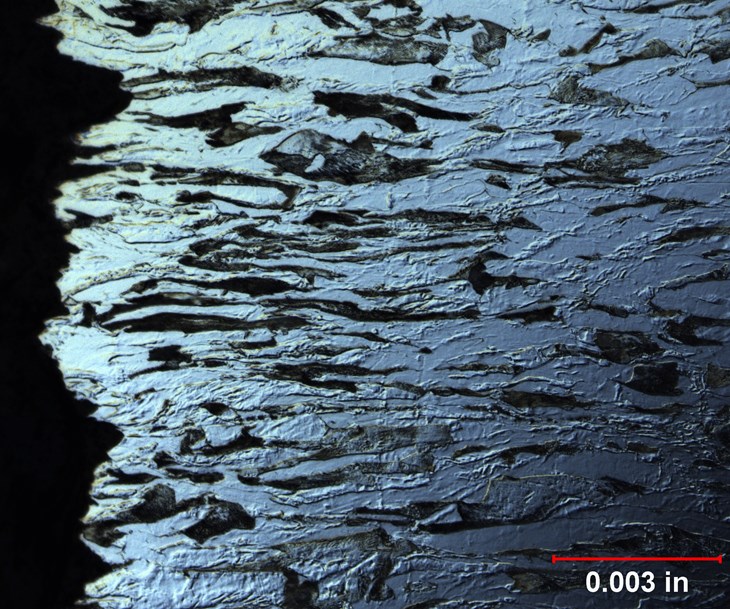 Figure 5. This image shows the microstructure of Necking on a carbon steel specimen after tensile test at 500X.