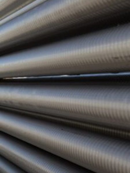 Thinner stainless teel tubes can be corrugated to reduce fouling and improve heat transfer.